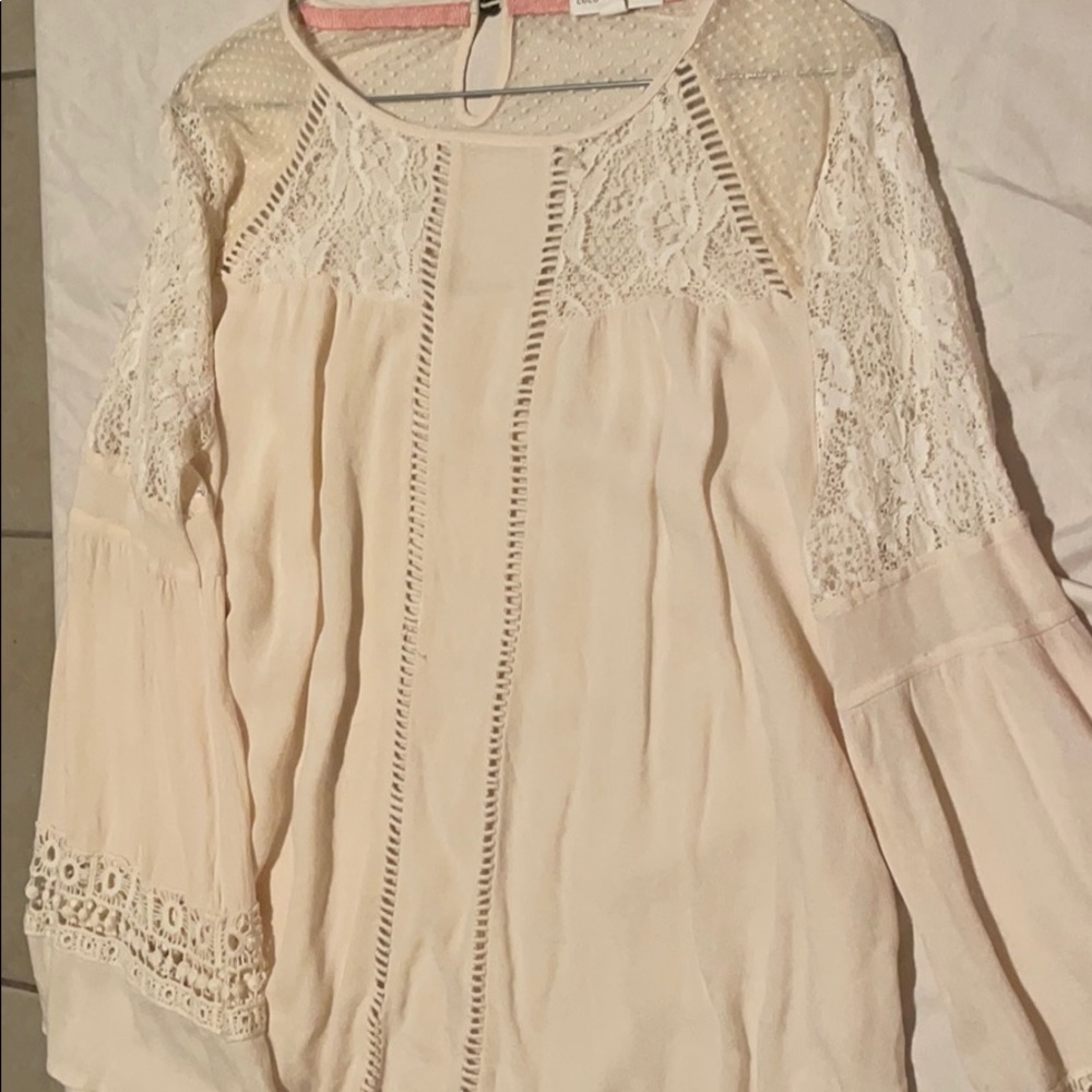 Long sleeved cream blouse